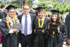 Adam Maldonado (second from left) with Mock Trial participants at their 2015 high school graduation